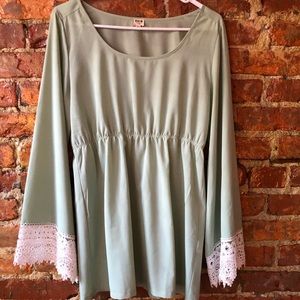 Light green silky tunic with white ruffles